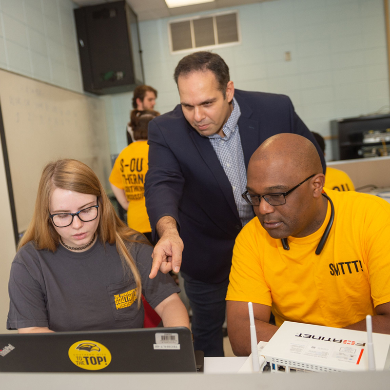 Photo of group using computer