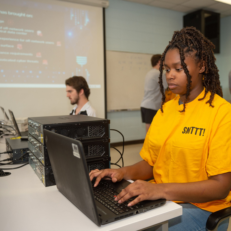 Photo of student using computing