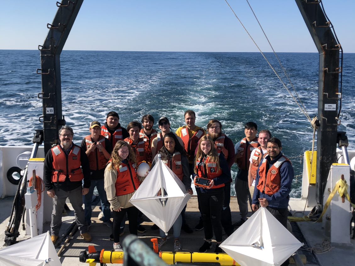 Photo of graduates on a research vessel
