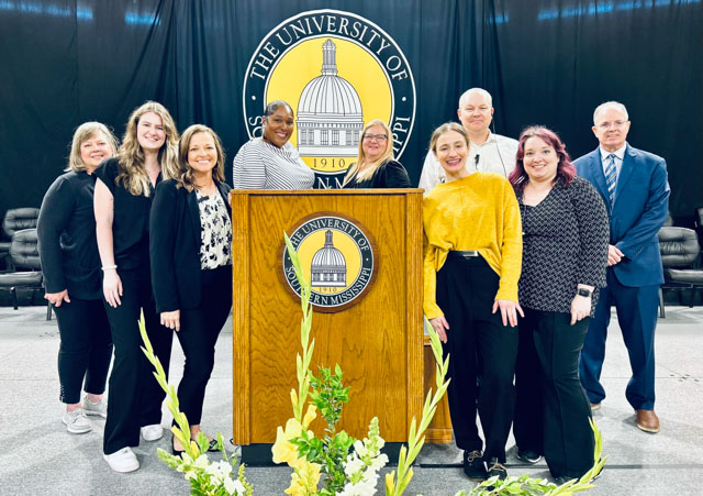 Members of the USM Registrar Office’s commencement planning team include, from left: Precia Pedersen, administrative assistant; Phoebe Magee, degree auditor; Nichol Green, associate registrar; Dana Berry, assistant registrar for degree audits and commencement; April Jordan, business analyst; Morgan Green, supervisor of records; Lemuel Boyer, assistant registrar for technical services; Erin Little, supervisor of degree audits; and Greg Pierce, university registrar (submitted photo).