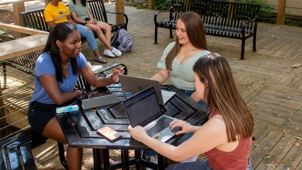 students talking at a table