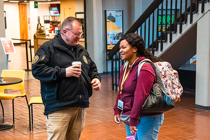 officer talking to student